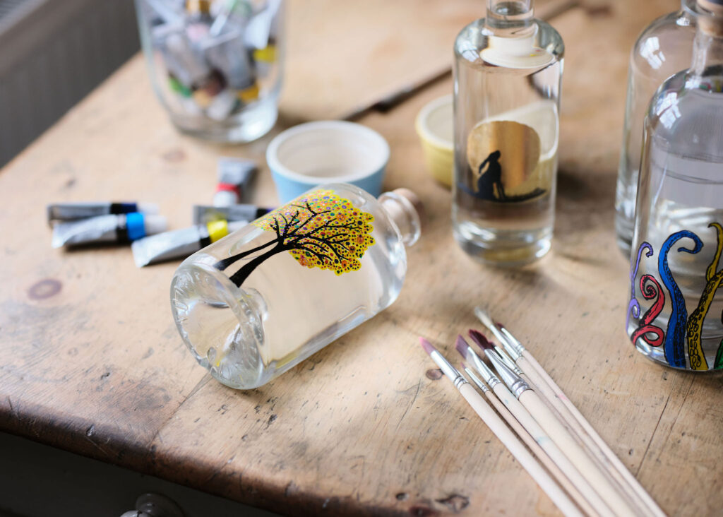 Artfully painted gin bottle, showcasing unique designs and craftsmanship that reflect the essence of premium gin – Say it with Gin.