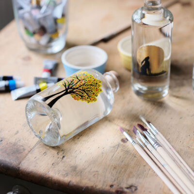 Artfully painted gin bottle, showcasing unique designs and craftsmanship that reflect the essence of premium gin – Say it with Gin.